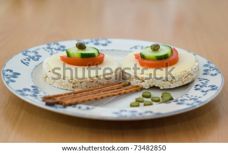 plate of rice cakes tomatoes cheese end salty sticks