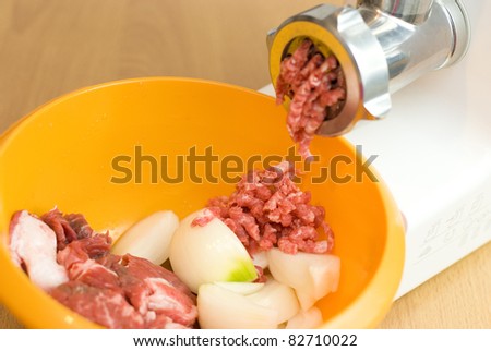meat through a meat grinder for force meat