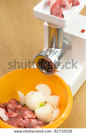 meat through a meat grinder for force meat
