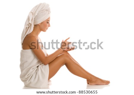 Young woman with body lotion