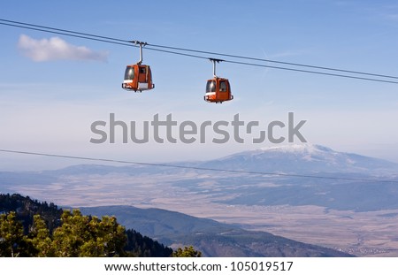 Cable car ski lift over mountain landscape. Rila mountains, ski resort Borovets, Bulgaria