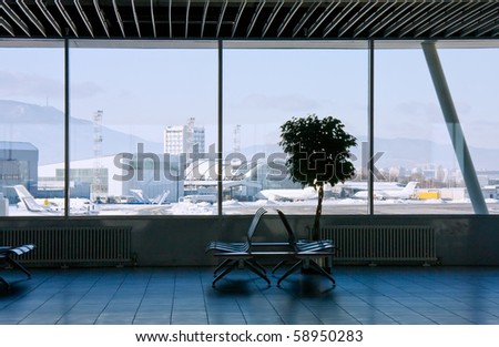 Airport terminal and view to mountain panorama from the window. International airport of Sofia, Bulgaria