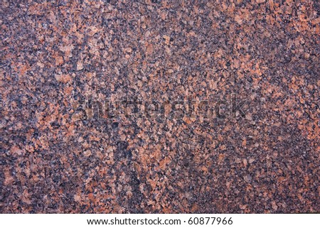 Natural weathered pink and black granite / marble texture background