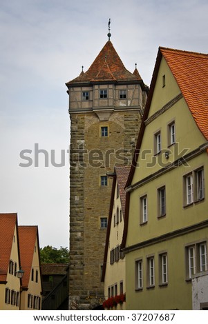 Corner tower of border wall and house in medieval bavarian town Rothenburg ob der Tauber, Germany
