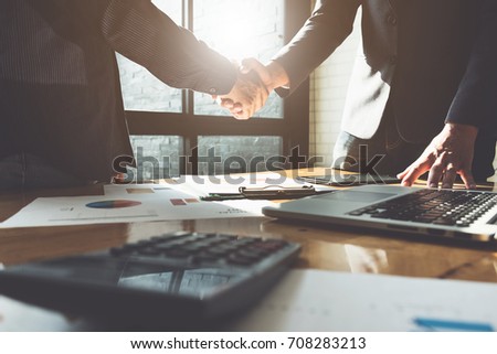 Business partnership meeting concept. Image businessmans handshake. Successful businessmen handshaking after good deal. Group support concept.