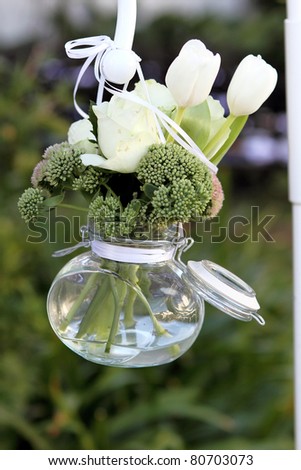 Flower arrangmnet, hanging glass jar, at wedding,