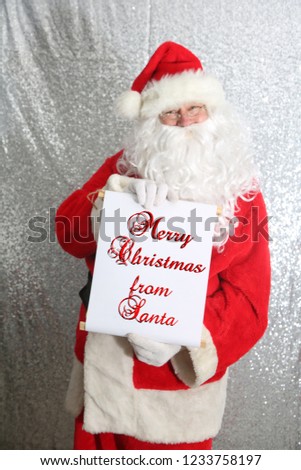 Santa Claus. Santa Claus with his Naughty or Nice List of Good or Bad Children. Santa Holds his list. text is removable and replaceable with your own. room for text.