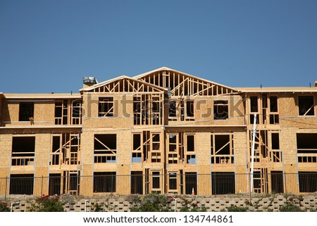 New Home or Condo Community Construction Site. New Homes being built with wood and other construction materials for new home buyers to live in and raise their families in Southern California.
