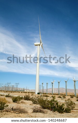 Wind Turbines at a Wind Farm in Southern California by Palm Springs produce Green Energy and help to power the homes and businesses of Palm Springs, Palm Desert, and surrounding cities.