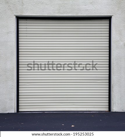A Genuine Aluminum Warehouse Garage Roll Up Door and Entrance Door. Many Warehouses and Office Buildings have Roll Up Garage Doors to make it easy to store vehicles and gain access to products.