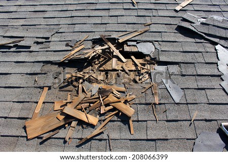Roof construction site. Removal of old roof, replacement with new shingles, equipment and repair. Roofs are a very important part of all housing projects around the world.