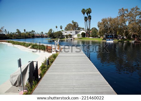 Private Lake with homes and boats in Lake Forest California. Lake Forest has many Private Lakes with limited access to the general public, making it an ideal and serene location to live life.