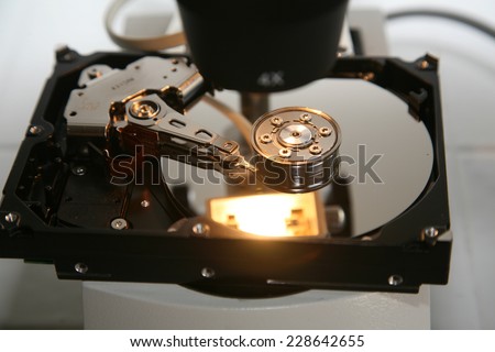 A Genuine Computer Hard Drive is repaired with the help of a Microscope. Microscopes are used to see images up to 400 times larger than with the naked eye, revealing defects and damage for repair