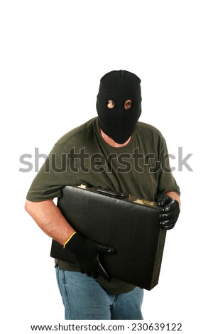 A Genuine Burglar aka Thief or Bad Guy, Robber, Stealer, Masked Man etc. wears a Black Ski Mask to hide his identity as he steals things from unsuspecting people. Isolated on white room for text