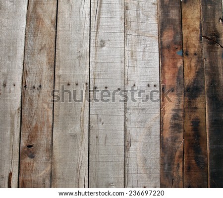 A genuine old wooden de-nailed pallet background. Wooden Pallet taken apart, the nails removed and planks laid vertical or can be turned horizontal for your use. Wood is made from trees.