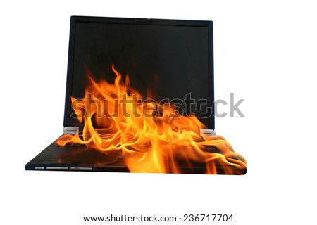 a Genuine Laptop Computer on fire. Isolated on white with room for your text. Represents Hot Love, Burning up the Internet, Setting the World on Fire, Computer Damage, Insurance claims, Hell Fire etc.