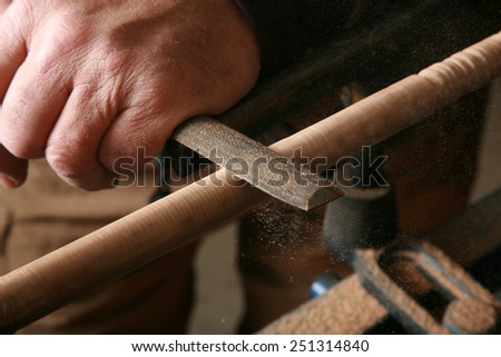 A wood worker works on a project on his lathe. Lathes are used by wood workers and metal workers for all sorts of projects around the world. Wood Working is a business and a hobby enjoyed by millions
