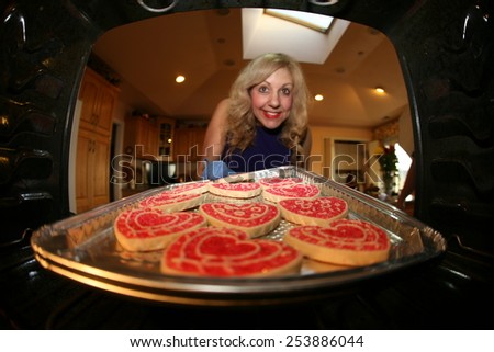 A sweet lady bakes up a batch of GLUTEN FREE Cookies. research showed between 0.5 and 1.0 percent of people in the US and UK are sensitive to gluten due to Celiac Disease. Gluten Free