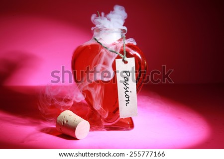 A Heart Shaped Bottle filled with a Love Potion with the tag PASSION on the label. Hot Steam is being released from the uncapped bottle on a Hot Pink background. Represents Love, Passion, Sex, etc.