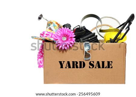 A large cardboard box filled with Yard Sale or Tag Sale items to be sold at a discount in order to make room and make some money at the same time. Yard Sales are an important part of our economy