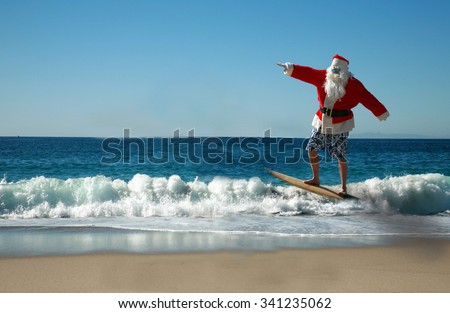 Surfing Santa. Santa Claus Surfs on his Surf Board while on a Beautiful Beach with a Blue Ocean. Focus on Santa/s Face. Santa Vacation. Surfing Santa. Santa goes Surfing.