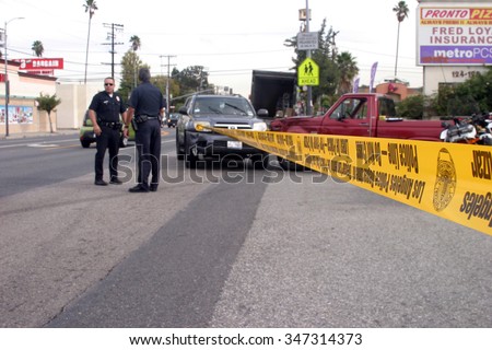 LONG BEACH, CALIFORNIA- DECEMBER 3, 2015: A High Speed Police Chase ends as the suspect car collides at an intersection with another car. Long Beach, California Dec. 3 2015