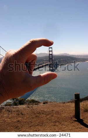 land of the giants, my fingers show how small the golden gate bridge really is in san franscisco california