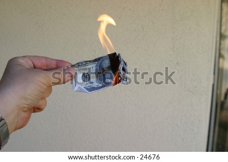 Money To Burn!\
\
A hand holding a One Hundred Dollar Bill on fire.