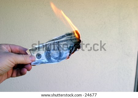 Money To Burn!\
\
A hand holding a One Hundred Dollar Bill on fire.