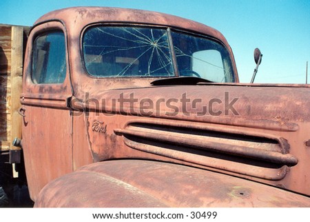 an old rusty truck sits in the blast furnice of the arizona sun in the summer reminding us of what was once was is now faded and gone but not forgotten
