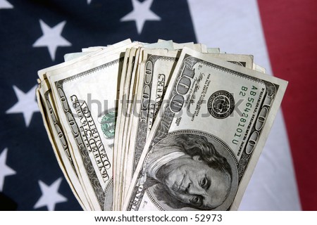 american cash on a silver platter, fanned out infront of an american flag
