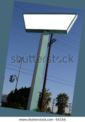 a blank (blank for your text) sign on a tall pole against a blue sky day