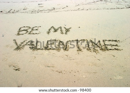 BE MY VALENTINE written in sand on the beach just in time for Valentines day