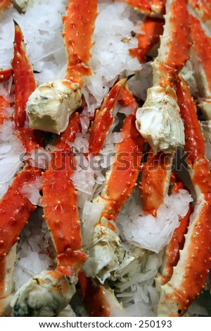 Cooked Alaska King Crab Legs on ice for sale at a public market