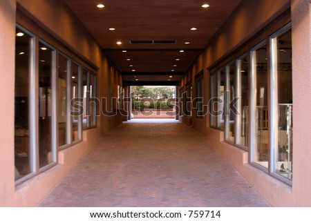 Interior hallway of a building with shop windows