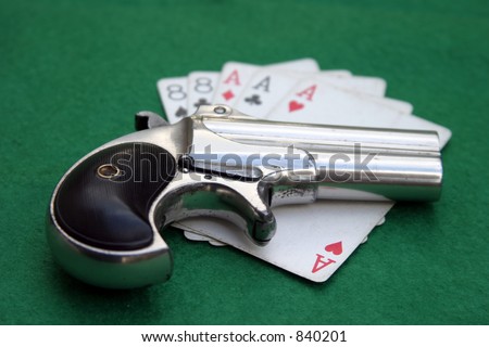 Circa 1889, Model 95, Type II Model 3 Double Derringer on card table with aces and eights aka a \
