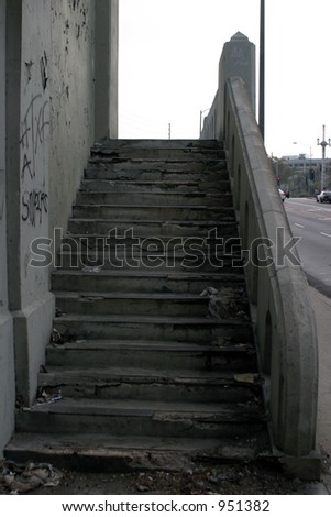 old dirt trash filled worn out concrete stairs in downtown  Los Angeles California