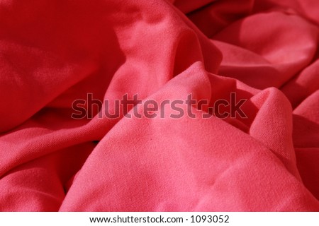 red cloth table napkins clumped up and wrinkled for background images