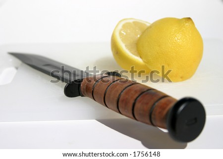 fresh cut lemon with a military knife