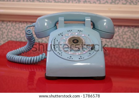 stock-photo--s-era-quot-old-school-quot-turquoise-rotary-telephone-1786578.jpg