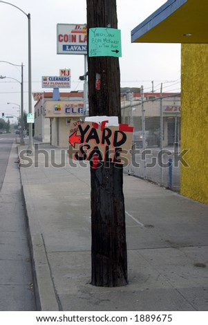 yard sale sign on a phone pole