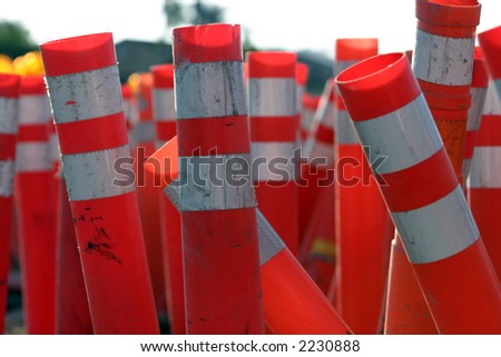 caution traffic signs, orange safety cones and amber warning lights