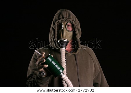 anti smoking concept a man in a gas mask attempts to smoke a cigarette through the filter