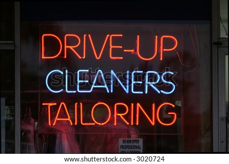 Neon Sign in a store window Drive-Up, Cleaners, Tailoring