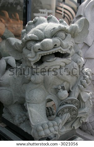 a cement dragon sculpture in china town in Los angeles california