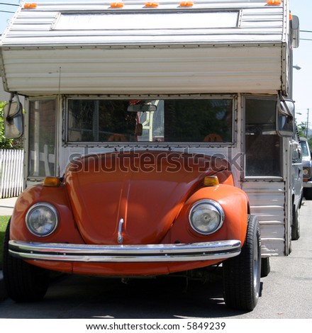 a probably one of a kind volkswagon beetle camper.........way cool