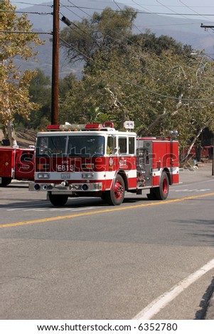 10-23-2007 The Santiago Canyon Fire in california Series. Firemen, Police, Fire Trucks Race to try to save homes and people and pets from the Wild Fires raging out of control