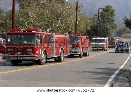 10-23-2007 The Santiago Canyon Fire in california Series. Firemen, Police, Fire Trucks Race to try to save homes and people and pets from the Wild Fires raging out of control