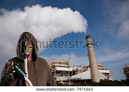 a man in a Gas Mask tries to smoke a cigarette infront of an industrial smoke stack representing Global Warming and Anti-Smoking Message at the same time