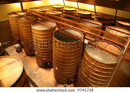 Oak Wine Barrels in a Winery in Napa California, fermenting wine for future drinking pleasure around the world